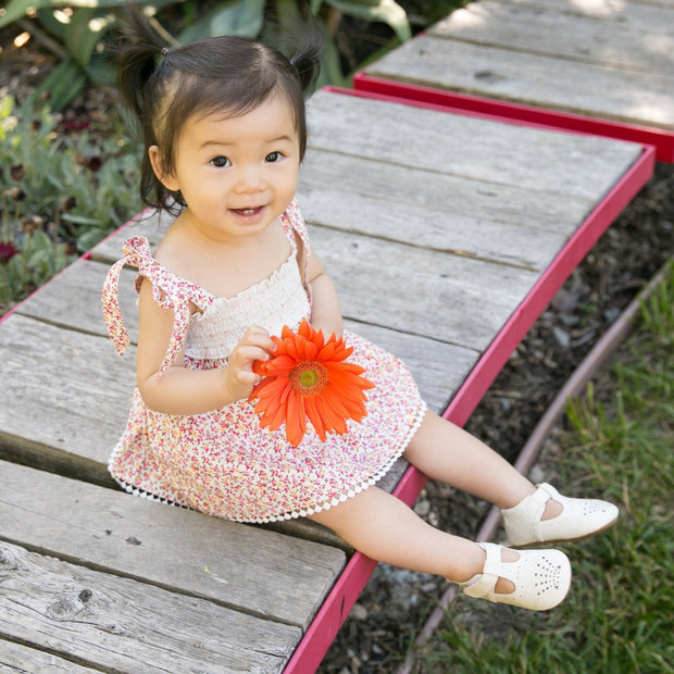 Cute baby wearing Cora Baby Shoe in White