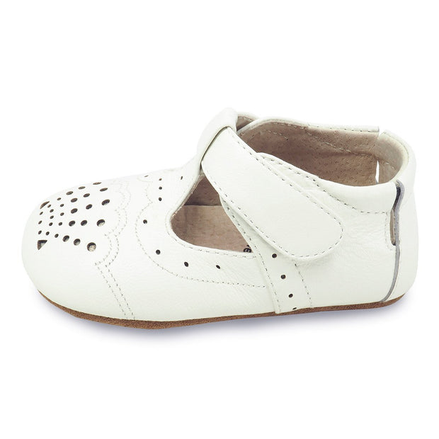 cora perforated baby shoe in milk, side view