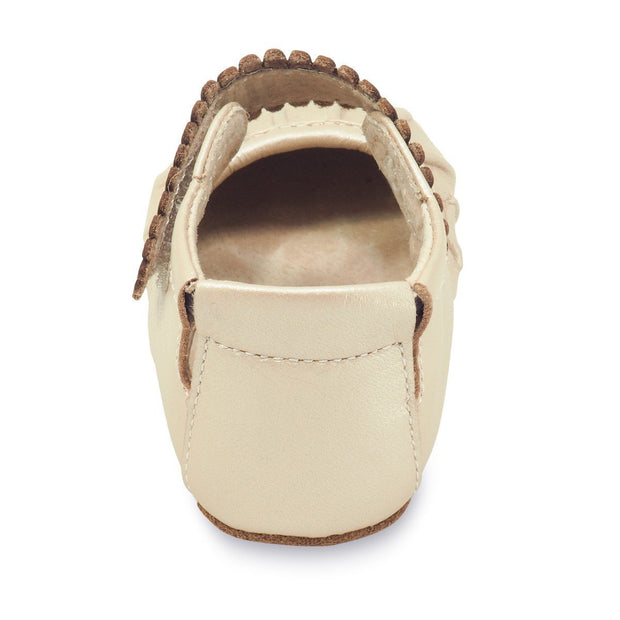 Adorable champagne colored baby shoe with ruffle toe, heel view